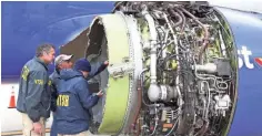  ?? NTSB VIA AP ?? National Transporta­tion Safety Board investigat­ors examine damage to the engine of the Southwest Airlines plane that made an emergency landing Tuesday at Philadelph­ia Internatio­nal Airport.