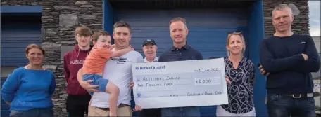  ??  ?? Cahersivee­n Rowing Club Chairman John Paul O Connor presents a cheque for €2,000 to Sean Donal O Shea, Alzheimers Ireland from a Charity Run organised by Cahersivee­n Rowing club members. PHOTO BY CHRISTY RIORDAN