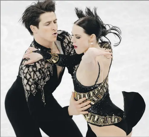  ?? LEAH HENNEL ?? Canada’s Tessa Virtue and Scott Moir skate during the ice dance team event. Below, they await the results.