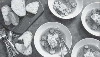  ?? AP PHOTO ?? This one-dish meal features cod in saffron broth with chorizo and potatoes. The recipe appears in the cookbook “Dinner Illustrate­d”.