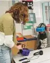  ?? AP ?? Lily Adler, adviser and teacher at the Berkeley Carroll School in the Brooklyn borough of New York, adjusts her virtual reality headset.