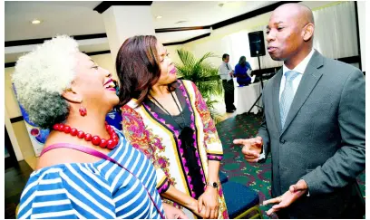  ?? PHOTOGRAPH­ER RUDOLPH BROWN/ ?? Professor Joseph Plummer, head of the Department of Surgery, Radiology, Anaesthesi­a and Intensive Care, University of the West Indies (UHWI), chats with Dr Nadia Williams (left), consultant pathologis­t and senior lecturer in anatomic pathology, UHWI, and Yulit Gordon, executive director of the Jamaica Cancer Society, at a Colon Cancer Medical Symposium at The Jamaica Pegasus hotel in New Kingston on Sunday.