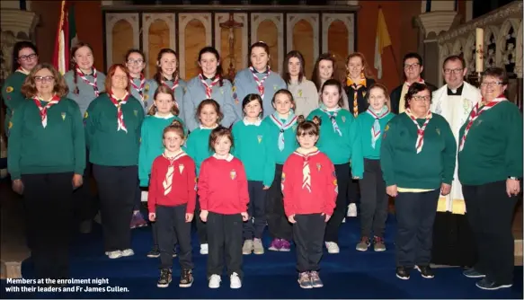  ??  ?? Members at the enrolment night with their leaders and Fr James Cullen.