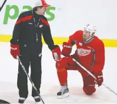  ?? CRaIG ROBERTSON/FILES ?? Then-Red Wings head coach Mike Babcock talks with Johan Franzen, who has called Babcock a bully, in 2012. Edmonton Oilers GM Ken Holland was in Detroit with Babcock and says some players didn’t like the coach, others did and some had no feelings either way.