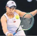  ?? AFP ?? Ashleigh Barty hits a return against Shelby Rogers on Monday.