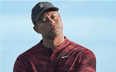  ?? FERNANDO LLANO/AP ?? Tiger Woods listens during the trophy ceremony of the Hero World Challenge at the Albany Golf Club in New Providence, Bahamas, on Dec. 5.