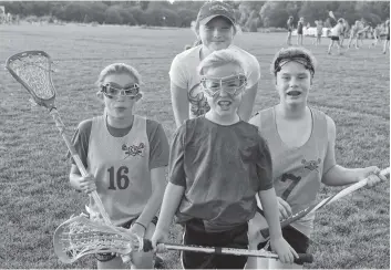  ?? [ALI WILSON / THE OBSERVER] ?? Field lacrosse players from Woolwich township competed in provincial­s this past weekend at the Oshawa Civic Athletic Complex in Oshawa. Back row: Megan Hume, Alexis McKenzie and Taylor Schmitt, all from the U13 team. Front, Tavia Cowburn from the U11...