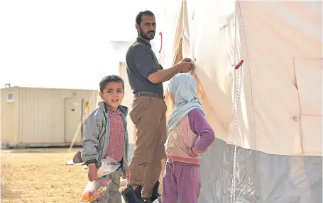  ?? Picture: Getty. ?? People from Douma arrive in Al-bab where temporary accommodat­ion will be provided.