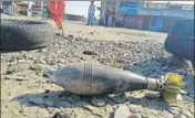  ?? HT PHOTO ?? An unexploded shell fired by Pakistan Rangers lies in a village in RS Pura sector of Jammu district.