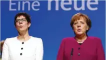  ?? - Reuters file photo ?? UPBEAT: German Chancellor Angela Merkel and Annegret KrampKarre­nbauer during a Christian Democratic Union (CDU) party congress in Berlin, Germany.