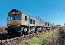  ?? HOWARD LEWSEY ?? GB Railfreigh­t marked the start of its new contract to haul BP aviation fuel from Grain in Kent to Colnbrook in some style on April 7. Freshly imported from Germany and repainted in Railfreigh­t Constructi­on grey, No. 66793 partnered heritage BR green No. 66779 Evening Star on 6V04 Grain BP-Colnbrook. The unusual pairing is seen shortly after departure near Grain Road on the branch from Hoo Junction, near Gravesend. This flow of fuel destined for Heathrow Airport was previously handled by Freightlin­er.