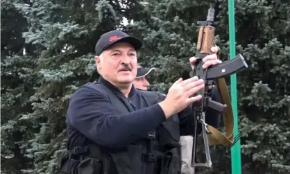  ??  ?? Alexander Lukashenko armed with a rifle in Minsk. Photograph: AP