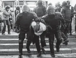  ?? Olga Maltseva / AFP via Getty Images ?? Police officers detain a protester Wednesday during a rally in support of jailed Kremlin critic Alexei Navalny in central St. Petersburg, Russia.