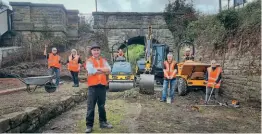  ?? GVTT ?? A lost narrow gauge station emerges from beneath the rubble: the Glyn Valley Tramway Trust workforce in the newly uncovered remains of Chirk station, which closed in 1935.