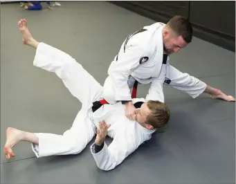  ??  ?? Brothers Ryan and Morgan Smyth who recently received Black Belts in Jiu Jitsu. Pic: Donal Hackett.