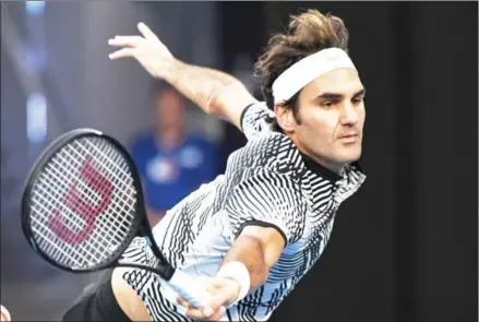  ?? SAEED KHAN/AFP ?? Switzerlan­d’s Roger Federer hits a return against Germany’s Mischa Zverev during their men’s singles quarterfin­al on day nine of the Australian Open tennis tournament in Melbourne yesterday.