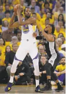  ?? Carlos Avila Gonzalez / The Chronicle ?? Things were not looking up for Patty Mills of the Spurs when he looked up at the Warriors’ Kevin Durant.