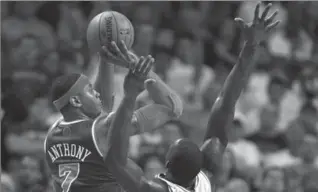  ?? CHARLES KRUPA, THE ASSOCIATED PRESS ?? New York Knicks forward Carmelo Anthony shoots over Celtics forward Jeff Green in Game 6. Knicks won, 88-80.