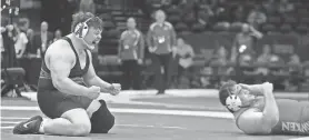  ?? JEFF LANGE/AKRON BEACON JOURNAL ?? Alliance’s Aidan Mozden celebrates after beating Hawken’s Will Greenberg in the 285-pound championsh­ip match in the 2024 Division II state wrestling tournament Sunday in Columbus.