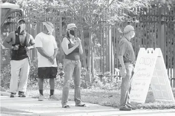  ?? WILFREDO LEE/AP ?? People wait in line at a walk-up coronaviru­s testing site during the COVID-19 pandemic at the Urban League of Broward County in Fort Lauderdale.