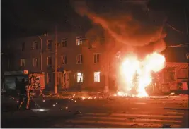  ?? GEORGE IVANCHENKO — THE ASSOCIATED PRESS ?? A firefighte­r’s vehicle is seen on fire after Russian drone strikes on a residentia­l neighborho­od in Kharkiv, Ukraine on Thursday.