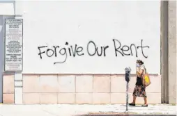  ?? Valerie Macon / AFP via Getty Images ?? Graffiti on a Los Angeles street calls for rent relief. The Democrats’ proposal would give renters a decade to repay deferred rent.