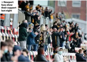  ??  ?? > Newport fans show their support last night