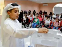  ?? Photo by M. Sajjad ?? Children from age 8-12 cast their vote for the Children’s Parliament on Tuesday. The council formed every two years, represents Sharjah children centres and schools of the emirate.—