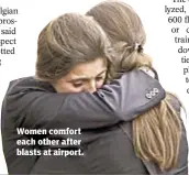  ??  ?? Women comfort each other after blasts at airport.