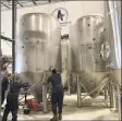  ?? Contribute­d photo ?? New tanks being moved into Athletic Brewing Co. in Stratford over the summer.