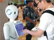  ?? FAN QIONG / FOR CHINA DAILY ?? A patient uses a robot to find his way around the USTC hospital in Hefei, Anhui province.