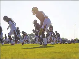  ?? Tribune News Service ?? The Chicago Bears warm up during training camp on July, 2019.