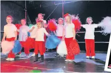  ??  ?? Cheering on the crowd Big Bird Nursery entertain on stage