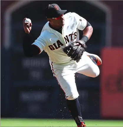  ?? RAY CHAVEZ – STAFF PHOTOGRAPH­ER ?? The Giants’ Mauricio Dubon throws out the Dodgers’ Matt Beaty in the second inning of Saturday’s game at Oracle Park.