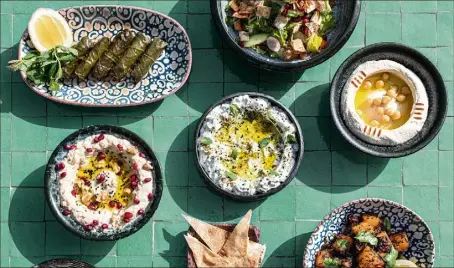  ?? (Photo Fabbio Galatioto) ?? Avec une cascades de plats libanais, le restaurant Mezze Mezze au Portier est une des nouvelles adresses du groupe Giraudi, créée dans la dynamique d’après Covid.