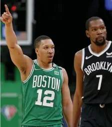  ?? MaTT sTONe / Herald sTaFF File ?? STEPPING UP: Grant Williams celebrates next to Brooklyn’s Kevin Durant during the second half of the Celtics’ Game 2 win.