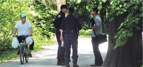  ?? NICK PROCAYLO ?? Police patrol Burnaby’s Central Park on Tuesday, after a 73-year-old man was attacked Sunday night in the park, receiving what the RCMP says are life-altering injuries. The attack comes nearly a year after Marissa Shen, 13, was killed there, but the two crimes appear unrelated.