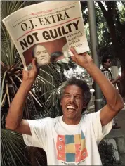  ?? ERIC DRAPER, FILE — THE ASSOCIATED PRESS ?? In this Oct. 3, 1995 file photo, Robert Graham holds the latest edition of the Pasadena, Calif., Star-news announcing O.J. Simpson being found not guilty of two murders, outside the Criminal Courts Building in Los Angeles.