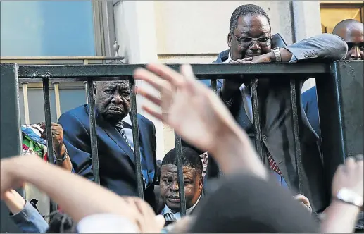  ?? Picture: THE TIMES ?? Higher Education and Training Minister Blade Nzimande, left, stands in the psychic void between fantasy and reality as he is faced with students protesting at Parliament.