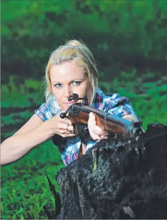  ?? Picture: KATRINA BRIDGEFORD ?? Michelle Martin from WA was thrilled to fire her grandfathe­r Louis Clandon Hook’s old rifle as part of her quest to find out more about him