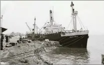  ?? Picture: Unicorn Collection ?? TIMBER AND TIDES: The Unicorn-chartered ship John Lyras (later renamed Boundary) loads timber in West Africa for Cape Town.