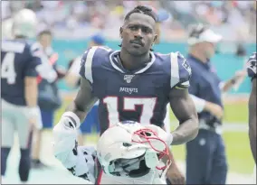  ?? LYNNE SLADKY - THE ASSOCIATED PRESS ?? FILE - In this Sunday, Sept. 15, 2019, file photo, New England Patriots wide receiver Antonio Brown stands on the sidelines during the first half at an NFL football game against the Miami Dolphins in Miami Gardens, Fla.