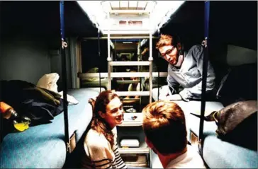  ?? AFP ?? Travellers chat in a sleeper car of the Paris-Nice night train, between Paris and Nice, on May 20 on the day it returns to service after being stopped since December 2017.