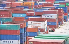  ??  ?? Shipping containers are seen at a port in Shanghai. China’s factory price inflation rose in June, the government said yesterday, as a trade war threatens producers in both of the world’s top two economies. — Reuters photo