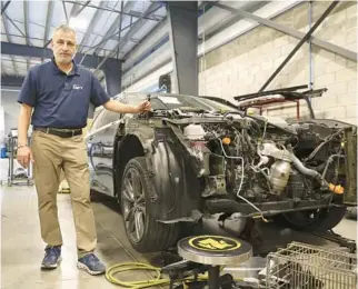  ?? CARLINE JEAN/SOUTH FLORIDA SUN SENTINEL ?? Hooman Rafiee, owner of Clancy’s Auto Body, has seen his business grow popular thanks to a string of funny videos on TikTok. Fans jokingly call themselves “Clancy’s Cult.”