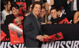  ?? Photograph: Mike Coppola/WireImage ?? Tom Cruise tries to convince the public to see the most recent Mission: Impossible film.