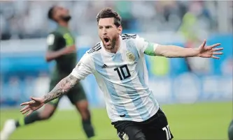  ?? PETR DAVID JOSEK
THE ASSOCIATED PRESS ?? Argentina’s Lionel Messi celebrates after scoring the opening goal in a Group D match against Nigeria at soccer’s World Cup in St. Petersburg, Russia, on Tuesday. Argentina’s win moved it to the knockout stage.