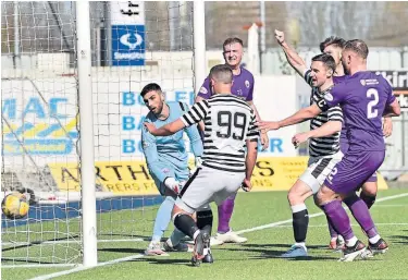  ??  ?? The ball goes into the net off Albion’s Daryll Meggatt for Queen’s Park’s winning goal