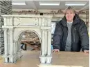  ?? Picture: BRANKO FILIPOVIC/ REUTERS ?? ANCIENT FIND: Archaeolog­ist Miomir Korac poses with a maquette of an ancient Roman triumphal arch, remains of which were found at Viminacium in Serbia