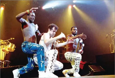  ?? BERTRAND GUAY/AFP ?? South African singer Johnny Clegg (centre) and dancers of South African band Savuka perform on stage at the Zenith concert hall in Paris as part of three-concert series dedicated to the fight against apartheid on May 10, 1988.